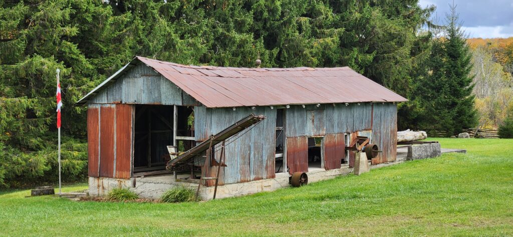 Sawmill barn, red roof, decaying